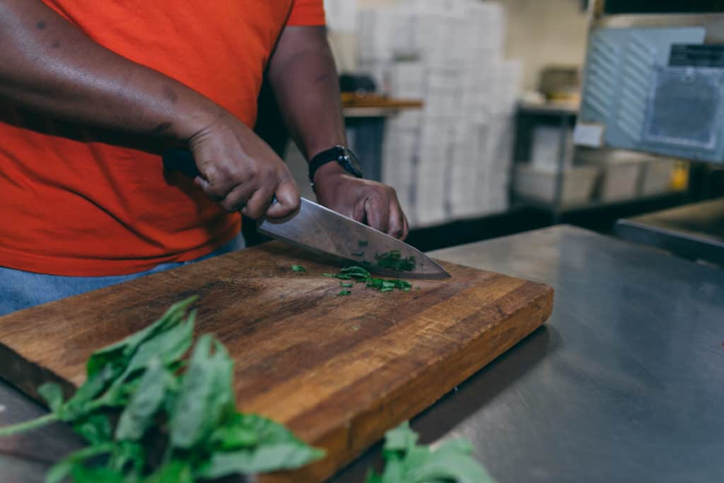 chef jason chopping spinach